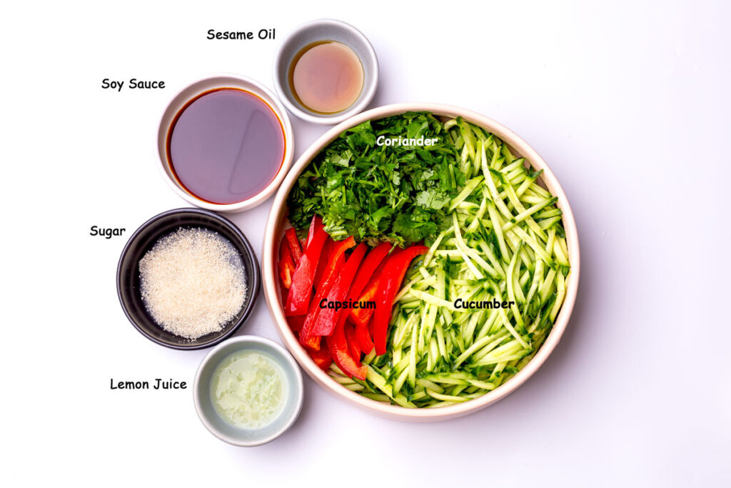 A healthy and light salad featuring cucumbers tossed in a flavorful Asian-style dressing