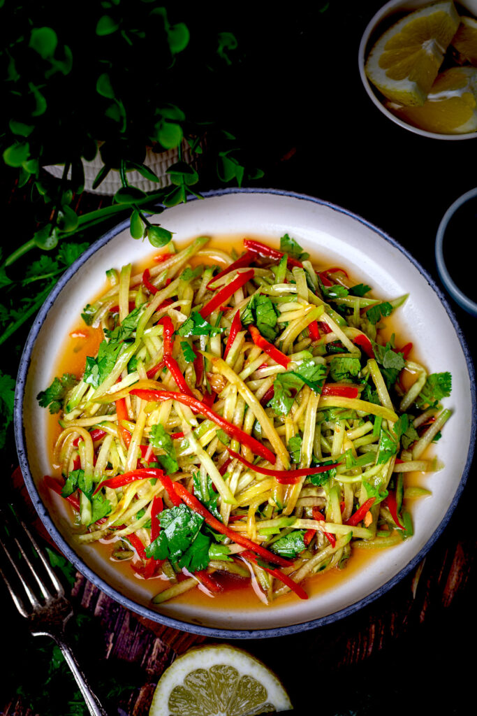 A healthy and light salad featuring cucumbers tossed in a flavorful Asian-style dressing