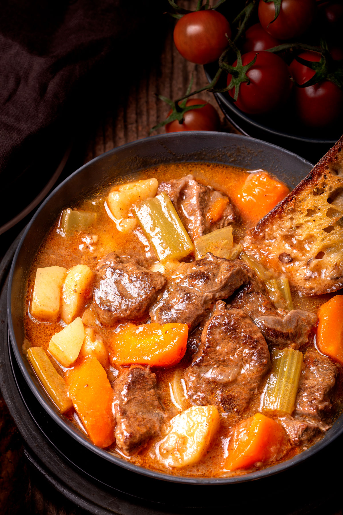 Image of Beef Shank Stew in a bowl with the toasted bread.