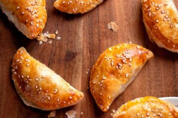 Several pork and prawn pastries, ready to be served. fork cut through